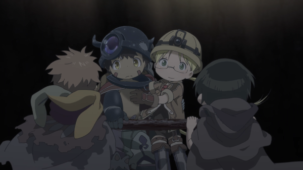 A boy wearing a metal helmet with horns and a girl wearing a miner's helmet and hiking gear hold onto each other and smile at two other figures with short hair who're facing away from the camera. They appear to be in some kind of mine.