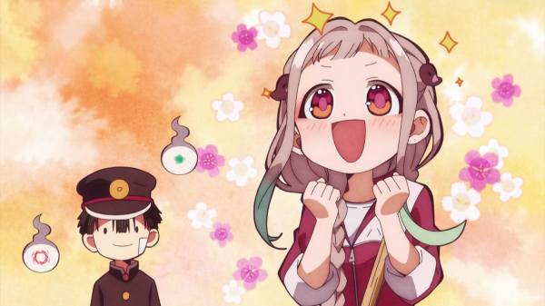 Yashiro clenches her fists together and sparkles happily. Hanako watches with a small smile in the background.