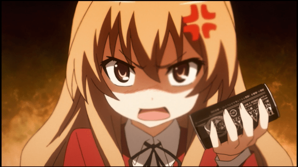 Taiga holding a can of coffee and looking furious